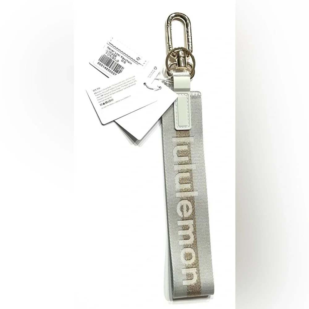 Lululemon Never Lost Keychain Wordmark Vapor Gold, NEW